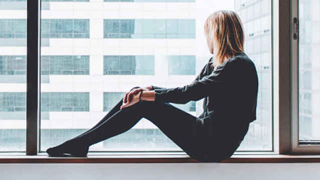 Pensive Woman in Office Environment